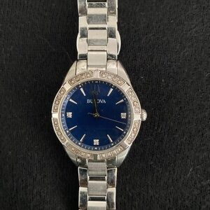 Beautiful watch with pave diamond detail and sapphire blue face. Perf condition